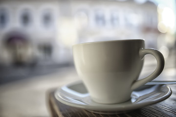 cup in an outdoor cafe / breakfast concept in a cafe, coffee, tea, morning drink