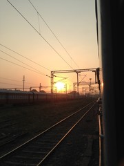 Naklejka na ściany i meble Perfect Sunset view from train