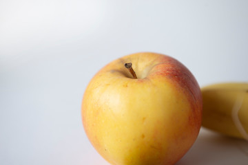 apple and banana fruit on white background