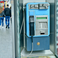 payphone on city street, telephone connection