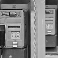payphone on city street, monochrome