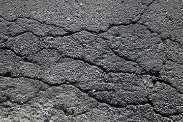 asphalt in cracks texture / abstract background cracks on asphalt road