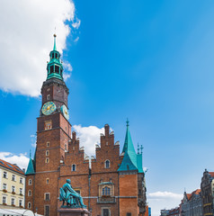 Aleksander Fredro memorial near Tower of Wroclaw Town Hall, which is located in central market square in Wroclaw, Poland