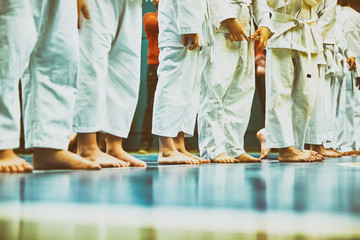 Concept karate, martial arts. Construction of students in the hall before training. Kimono,...