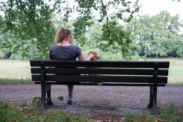 close up on lonely woman on the bench