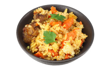 pilaf with meat in black bowl isolated on white background