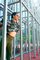 Smiling of beautiful woman posing with city building background. Wellness concept. Calmness and relax, woman happiness.