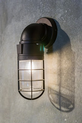 industrial style lantern on concrete wall.