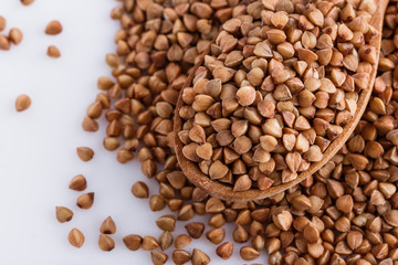 Grain buckwheat on a white acrylic background