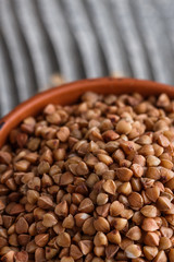 Grain buckwheat on a gray wooden background