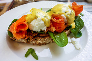 Toast with egg, salmon, bernese sauce and egg.