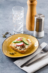 Delicious tuna sandwich, served with radish and cucumber