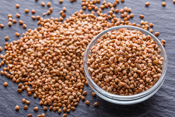 Grain buckwheat on a dark stone background