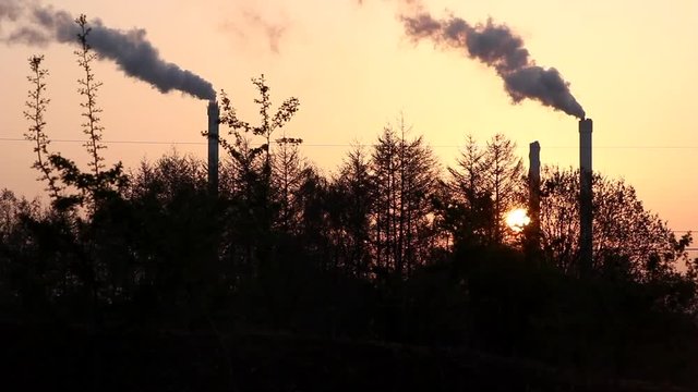Timelapse of chimneys in the morning sun