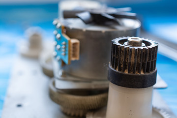 Part of laser printer - block with a electric motor and cogwheels.
