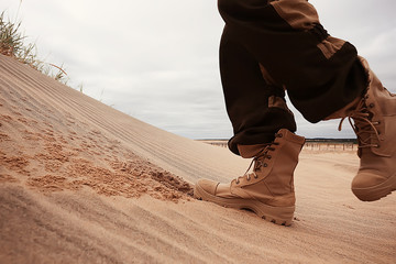 military exercises in the desert / legs in army boots, soldiers of the desert