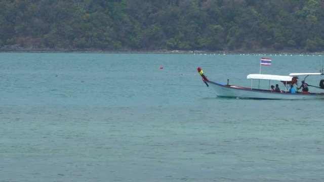 traditional Thai longtail boat sailing in the sea