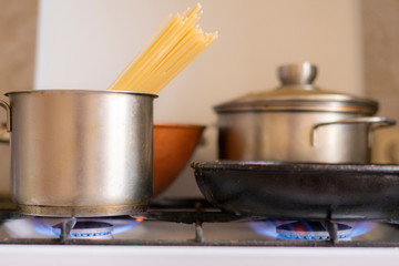 working obrn eith burning gas and pan with boiling tasty food in it,home cookings