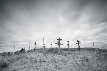 grave crosses in a desert cemetery / climate change concept warming, disaster, apocalypse,...