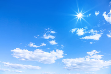 typical beautiful blue sky sun clouds background