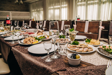 served banquet tables for celebrations and holidays with food on them