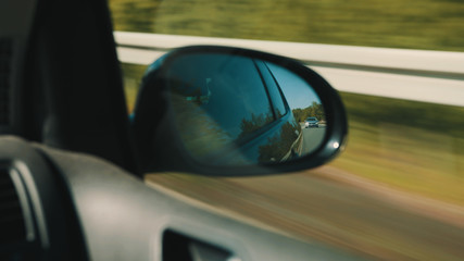 Following Spy Car in Back Mirror