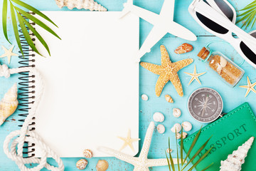 Planning summer holidays, trip, travel and vacation background. Open notebook with accessories on...