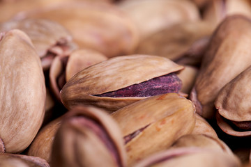 Pistachio on wooden table. Healthy food and snack.
