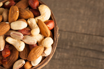 mix of nuts on a wooden table