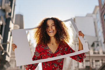 Attractive woman with photo frame