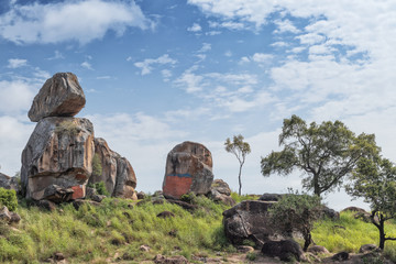 Solitary stones inserted in the African vegetation on the way to northern Angola. Soyo. Africa.