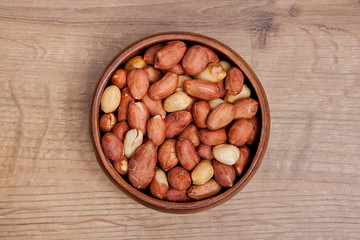  Peanut in a bowls on wooden table.Healthy food and snack.