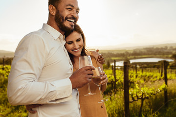 Couple spending time together on a romantic date in a vineyard