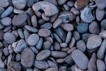 Rocks on the beach.stone and white sand.Blurred and soft focus.
