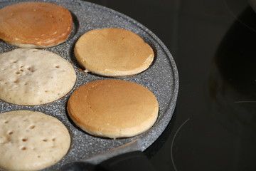 Making of pancakes on pan. breakfast concept