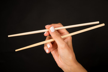 Hand with chopsticks
