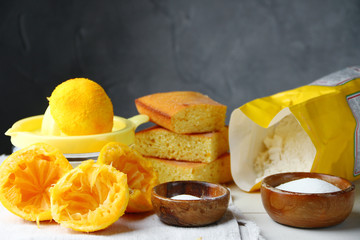 orange cake or bread with ingreients on table
