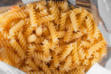 durum wheat spiral pasta in plastic wrap.