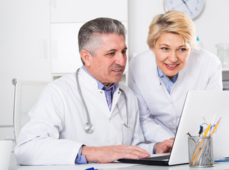 Fototapeta premium Doctor and nurse reading information