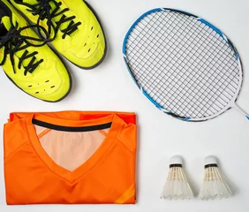 Selbstklebende Fototapeten Equipment for playing badminton, Shoes, Sport shirt, Badminton racket, Badminton ball © Songwut Pinyo