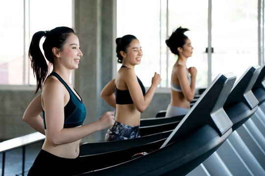 Group Asian beautiful women are running on electric treadmill in the gym. Help to burn calories well. All muscles are fully exercised. Suitable for people who do not have time to exercise outdoor.