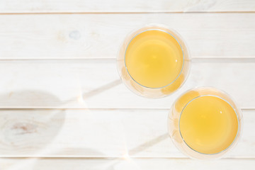 Orange wine in glasses. Food trend. Rustic background