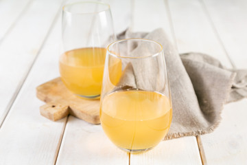 Orange wine in glasses. Food trend. Rustic background