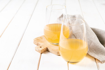 Orange wine in glasses. Food trend. Rustic background