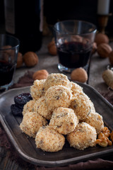 Snack cheese balls with prunes and walnuts, selective focus