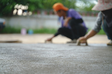 Asian worker labor working with concrete cement floor
