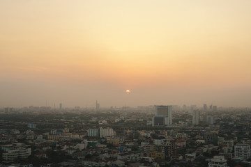 Sunset at Bangkok, capital of Thailand with dust and smoke
