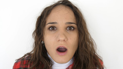 Portrait of young surprised and shocked teen girl on a white background