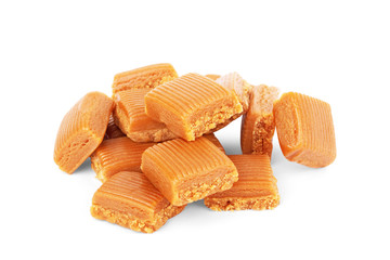 Four square pieces toffee caramel close-up isolated on white background