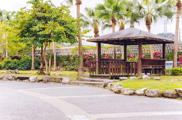 A wooden pavilion in the park. 